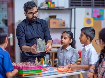 man-black-shirt-is-teaching-children-about-game-play_1153744-14468